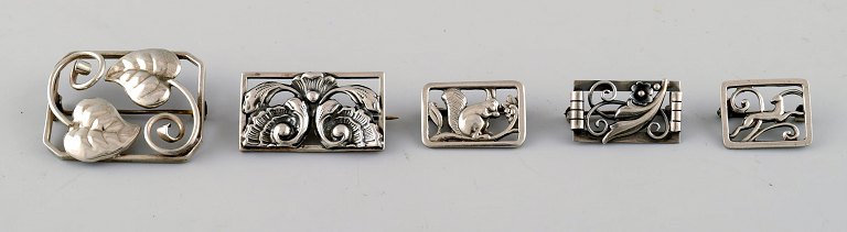 Five Danish art nouveau and art deco brooches, among others by Hugo Grün.