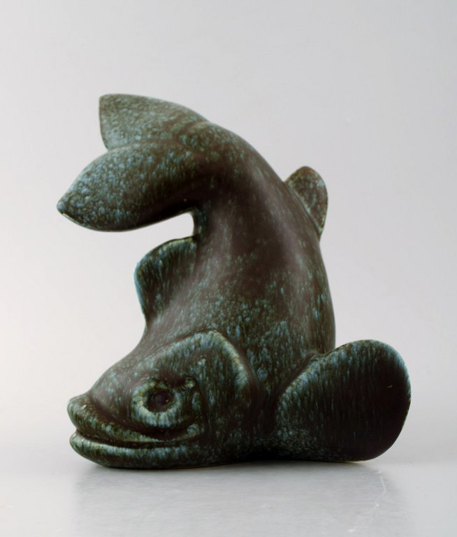 Scandinavian ceramist. Dolphin in ceramics, glazed green.
