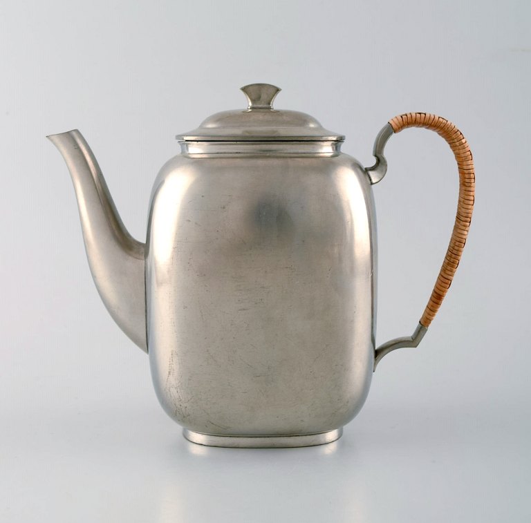 Just Andersen art deco coffee pot in pewter with handle in wicker.

