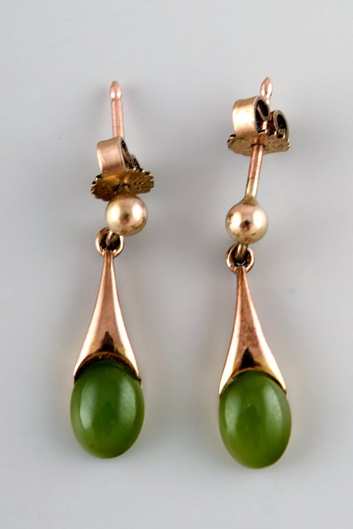 Danish 8K gold ear studs with green stones. Mid-1900s.
