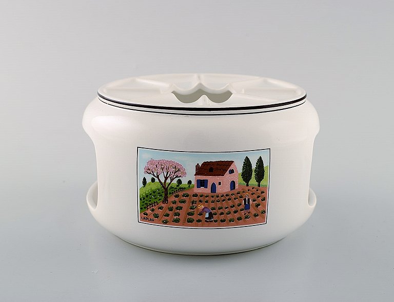 Villeroy & Boch Naif tea cozy for tea lights in porcelain decorated with naivist 
village motifs.