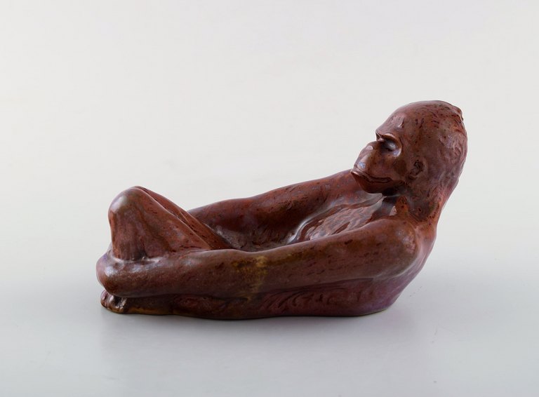 Hjorth (Bornholm) glazed stoneware figure. Lying monkey. 1940.
