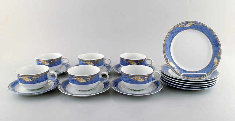 Royal Copenhagen. Set of six "Magnolia" tea cups with saucers and six plates. 
Late 20th century.