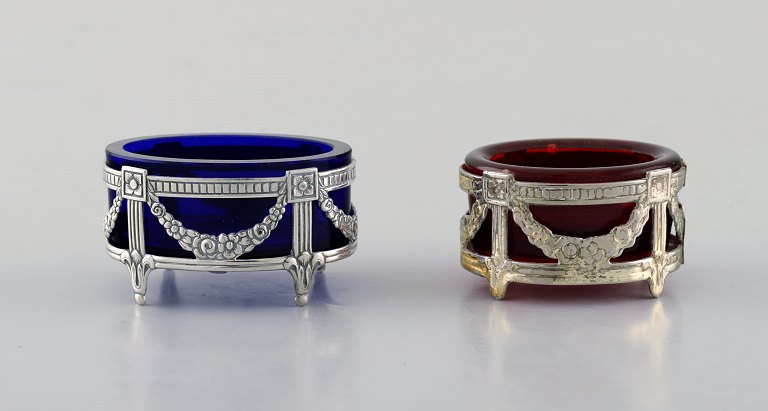 Swedish silversmith. Two silver salt vessels. Empire style with royal blue and 
red glass inserts.
