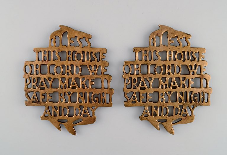 Estrid Ericson for Svenskt Tenn, Stockholm. Two "Bless this house" trivets in 
brass. Mid-20th century.
