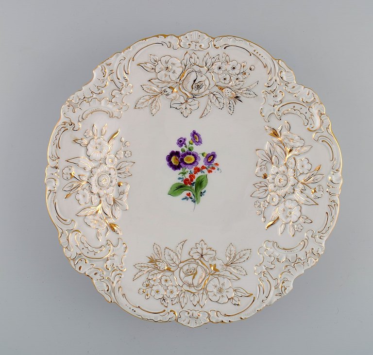 Antique Meissen porcelain bowl with hand-painted flowers and gold decoration. 
Early 20th century.
