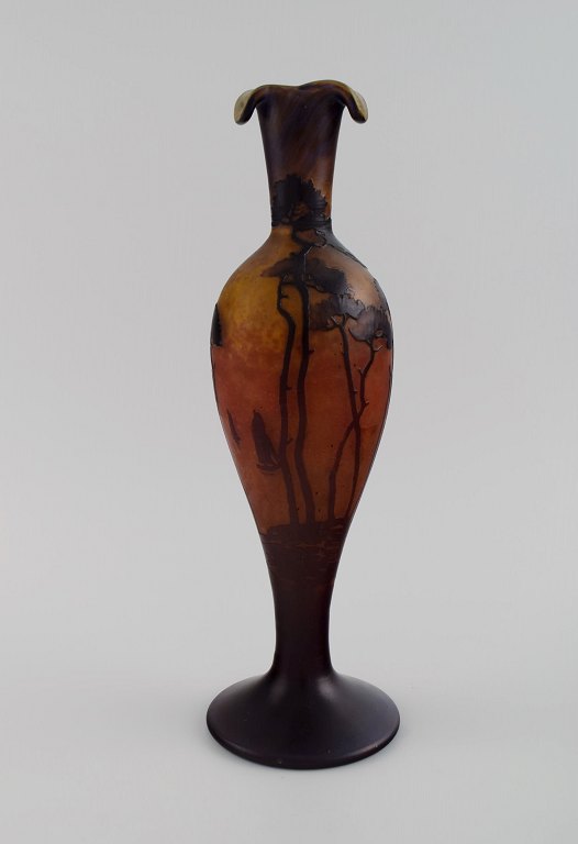 Muller Frères, France. Vase in smoky and dark art glass with carved in the form 
of branches with flowers and foliage. 1920s.
