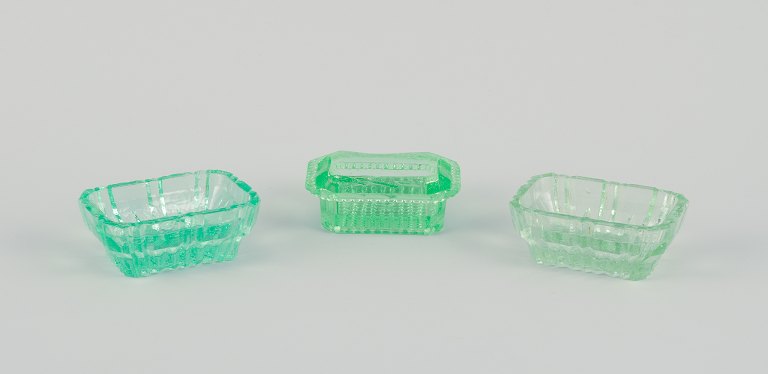 Fåglavik Glasbruk (1874-1980), Sweden.
Three salt cellars in colored glass. Handmade green glass.