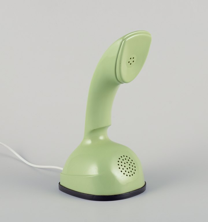 Ericsson Cobra / Ericofon, analog telephone in light green plastic.